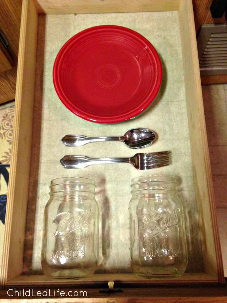 Great Montessori setup in an RV. Montessori kids can prepare their own snacks and drinks with access to their own cups, plates, and silverware.
